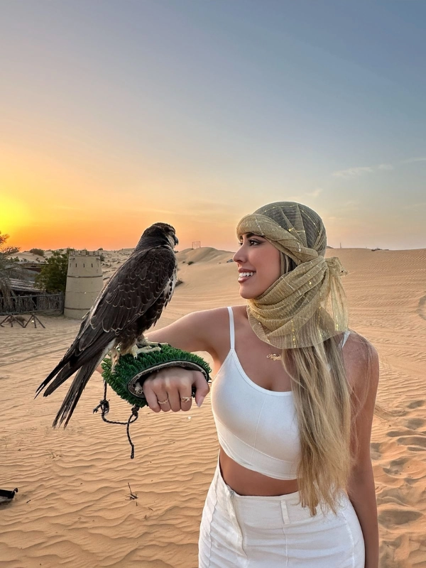 Camel ride in the Dubai desert during early morning tour